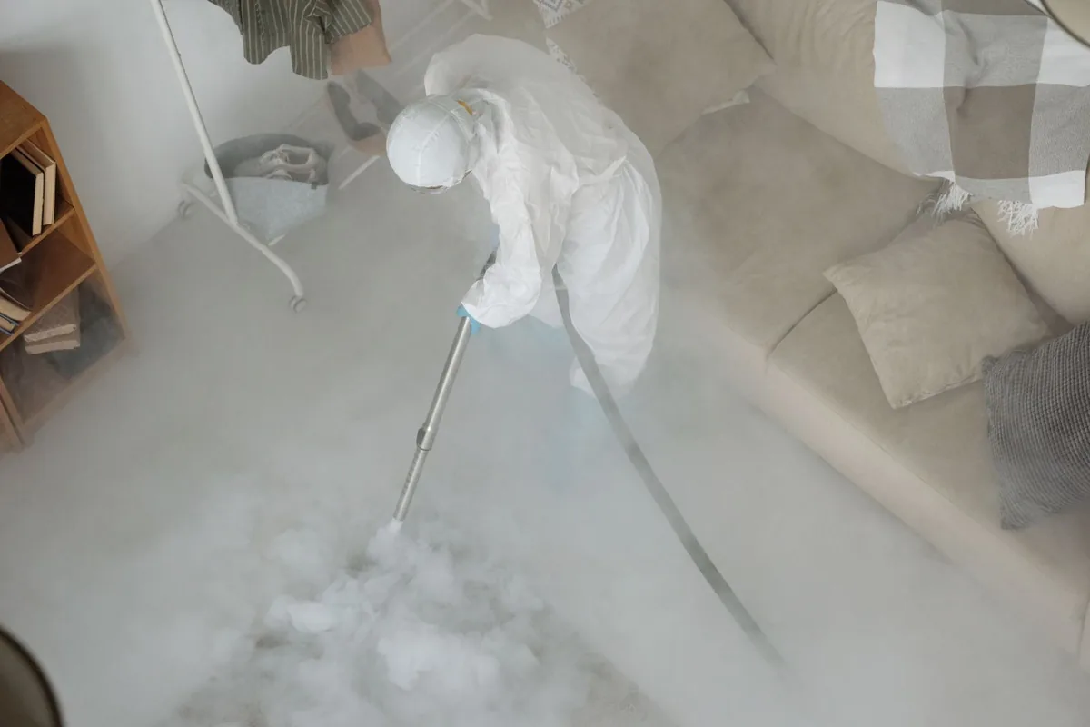 Biohazard cleanup technician in protective equipment, Ridley Park, PA
